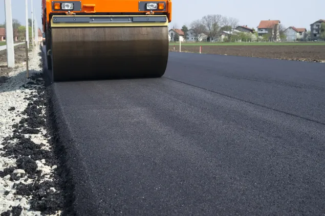 Paver on concrete road